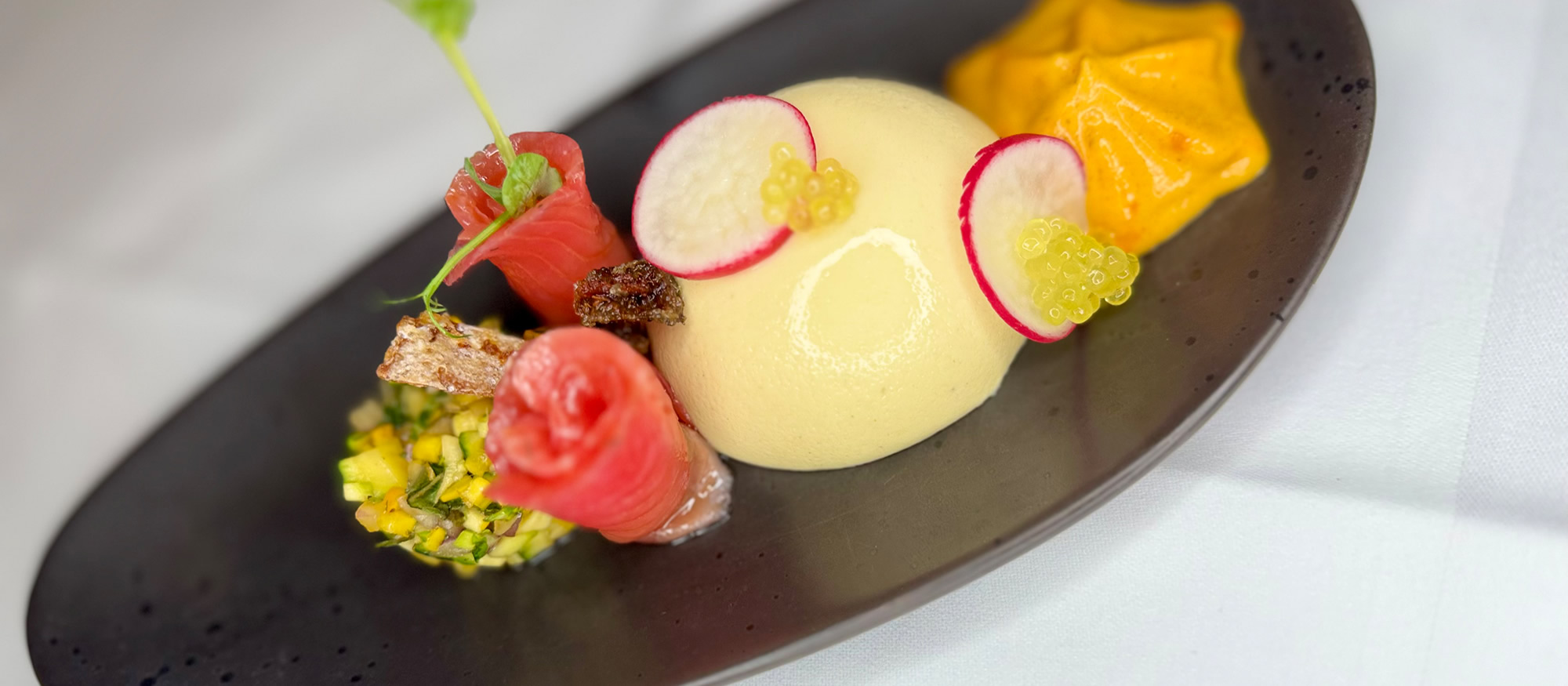 Heimische Köstlichkeiten wie gebeiztem Lachs im Restaurant Pariente in Rohrmoos-Schladming